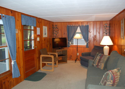 Cottage #2 living room with recliner, sleeper sofa and TV