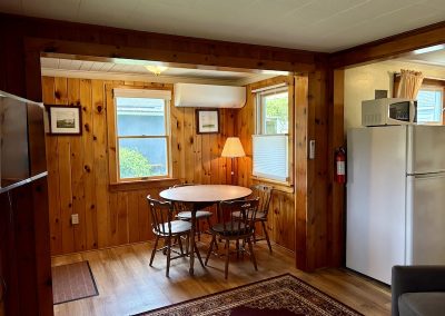 A dining table and four chairs in a cottage