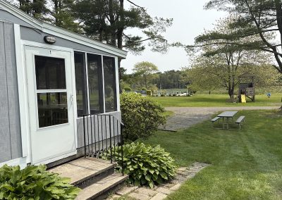 The entrance to a cottage overlooking a field